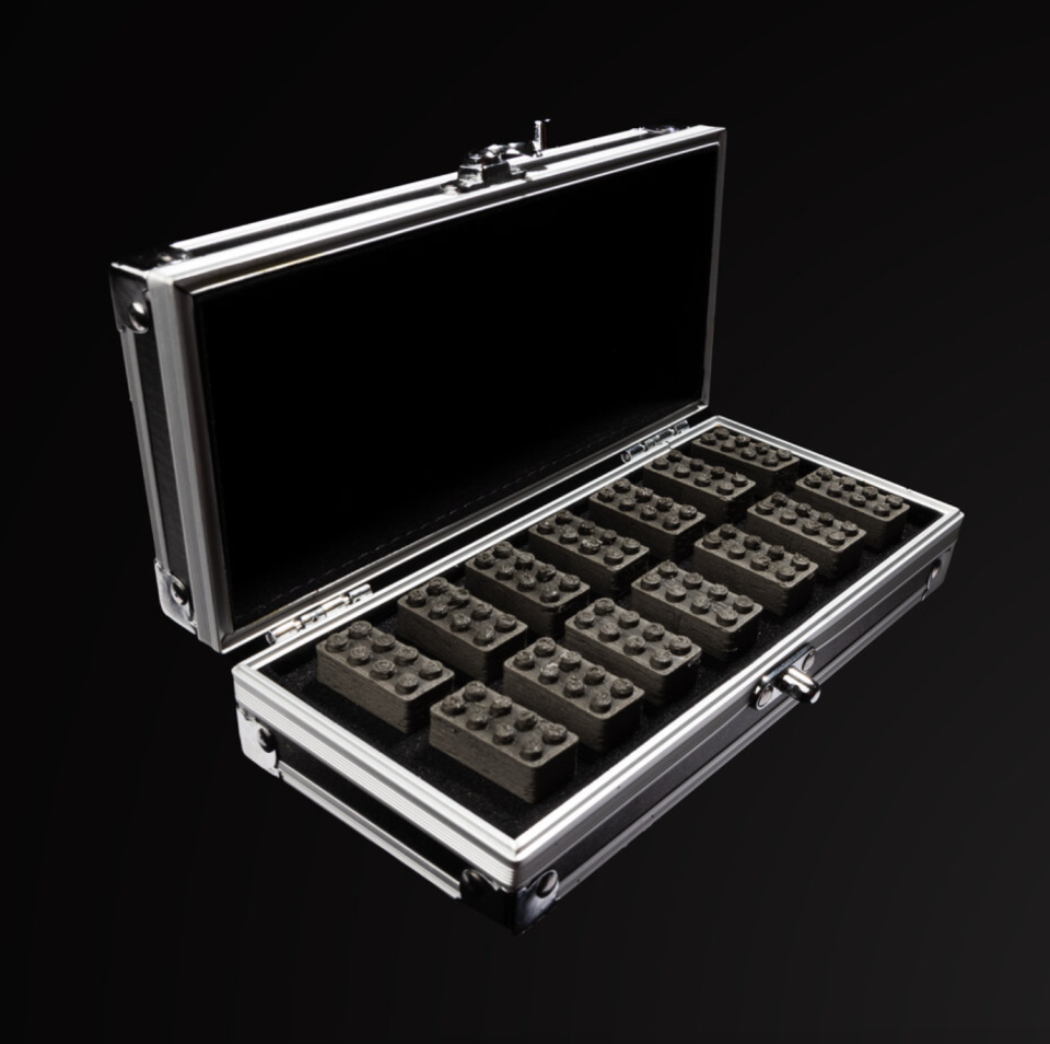 A case filled with Lego bricks.